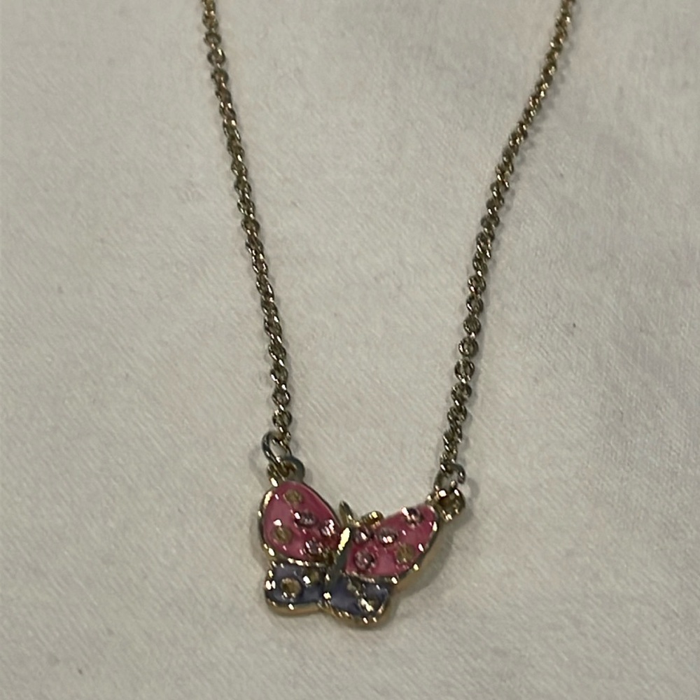 Gold tone pink purple clear cut crystal butterfly pendant necklace with bird ext